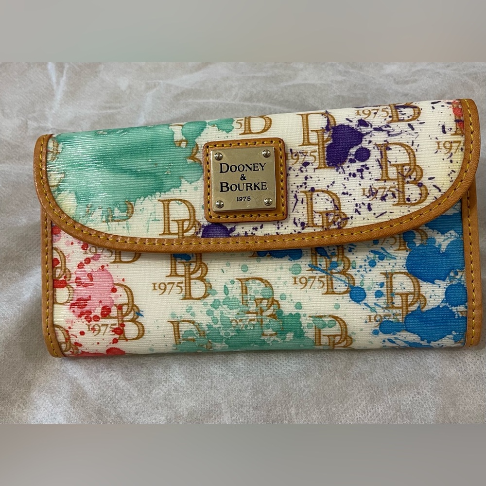 Dooney&Bourke wallet. Leather interior. Used condition. No tears.